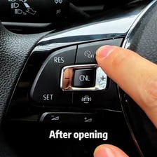 A car dashboard showing a cruise-control control