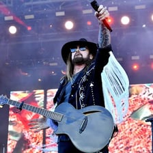 Billy Ray Cyrus performing as a country music singer