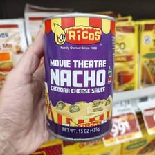 A serving of nachos topped with melted cheese.