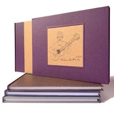 A hardcover book partially enclosed in a protective slipcase.