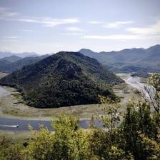 A broad panoramic view of mountains and surrounding landscape