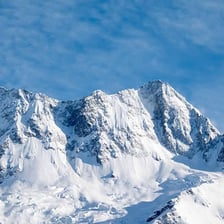 A mountain peak covered with snow