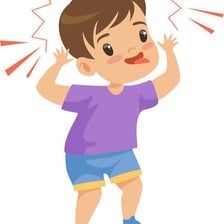 A playful child making a mischievous expression