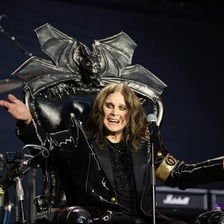 Ozzy Osbourne performing at a live concert.