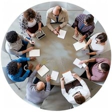 Colleagues working together around a table on a shared task