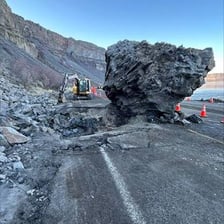 A mass of rocks sliding down a steep mountain slope