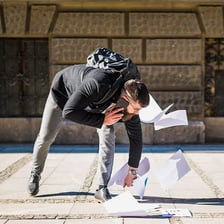 A person walking with an exaggeratedly awkward and clumsy gait