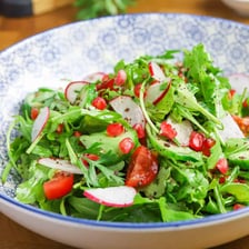 Fresh green arugula, also called rocket, arranged as salad leaves
