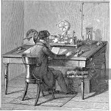 A telegraph operator using a Morse key to send a message.