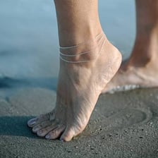 Decorative anklet jewellery worn around a person’s ankle