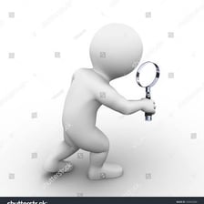 A person looking carefully for an object with a magnifying glass.