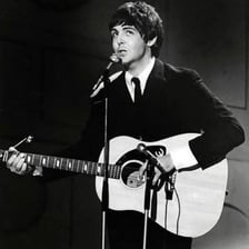 The Beatles performing the song “Yesterday.”