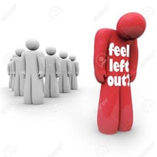 A person standing apart from a group, illustrating alienation.