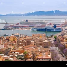 A view of Cagliari’s cityscape and harbor on the coast of Sardinia.