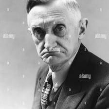 A person with a visibly grumpy expression