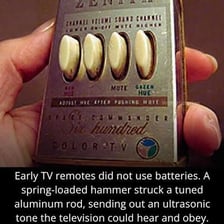 A handheld television remote control with buttons for operating a TV.