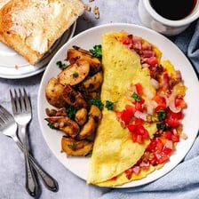 A Denver omelette and a Spanish omelette shown as two distinct dishes