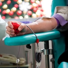 A person giving blood as a donor