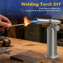 A blowtorch directing a flame onto a piece of metal.
