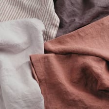 A shirt lying in a heavily wrinkled, crumpled condition.
