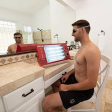 Protective goggles placed on a tanning bed