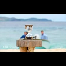 An hourglass used as a timer on a survival competition show