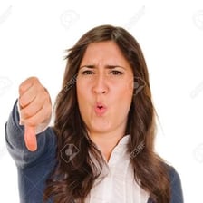 A person making a thumbs-down gesture to show disapproval.