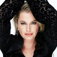 A portrait of actress and model Rebecca Romijn.