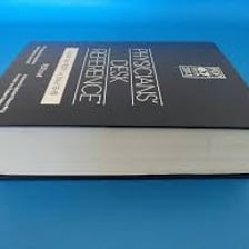 An authoritative reference book representing an accepted standard