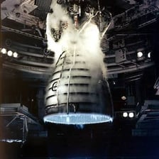 Rocket engines firing to propel a spacecraft.
