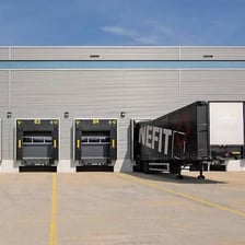 Commercial loading dock beside a cargo truck