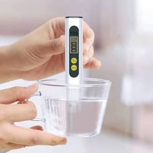 A glass of water being assessed for whether it is safe to drink.