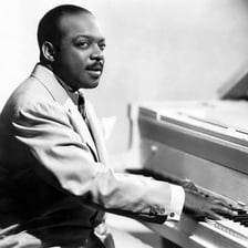Count Basie performing with his jazz orchestra.