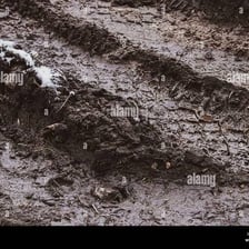 A surface visibly smeared with mud or dirt.