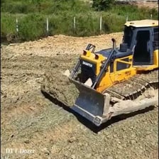 A bulldozer pushing soil at a construction site
