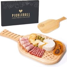 A large thick piece of cheese on a cutting board.