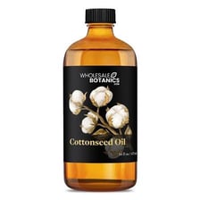 Cottonseed cooking oil shown beside cotton bolls.