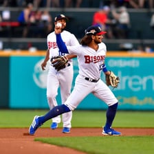 Players from the Buffalo Bisons competing in a baseball game.