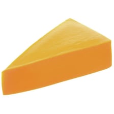 A wedge of yellow cheddar cheese