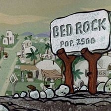 An illustrated view of Bedrock, the fictional town from The Flintstones.