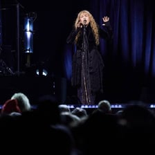 Stevie Nicks performing as a singer on stage.