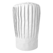 A tall, white, pleated chef’s hat.