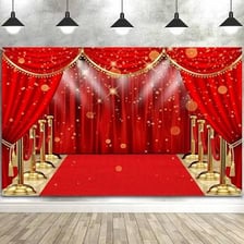 A brightly decorated red carpet scene with glittering lights