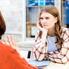 A person openly expressing frustration during a conversation.