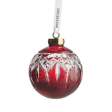 A small decorative ornament displayed as an attractive trinket.