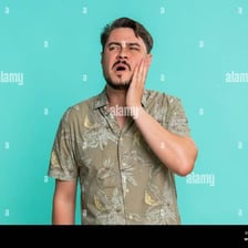 A person making an involuntary grimace in response to sudden pain