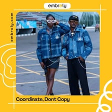 Two people dressed in matching clothing.