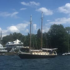 A two-masted ketch sailboat viewed on the water.