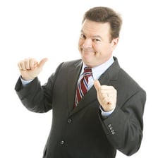 A person speaking proudly to a small group