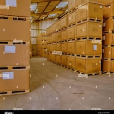 A wooden pallet holding stacked boxes in a warehouse
